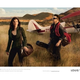Illustration for article titled Ubiquitous Bono Models For Vuitton With Wife Ali Hewson